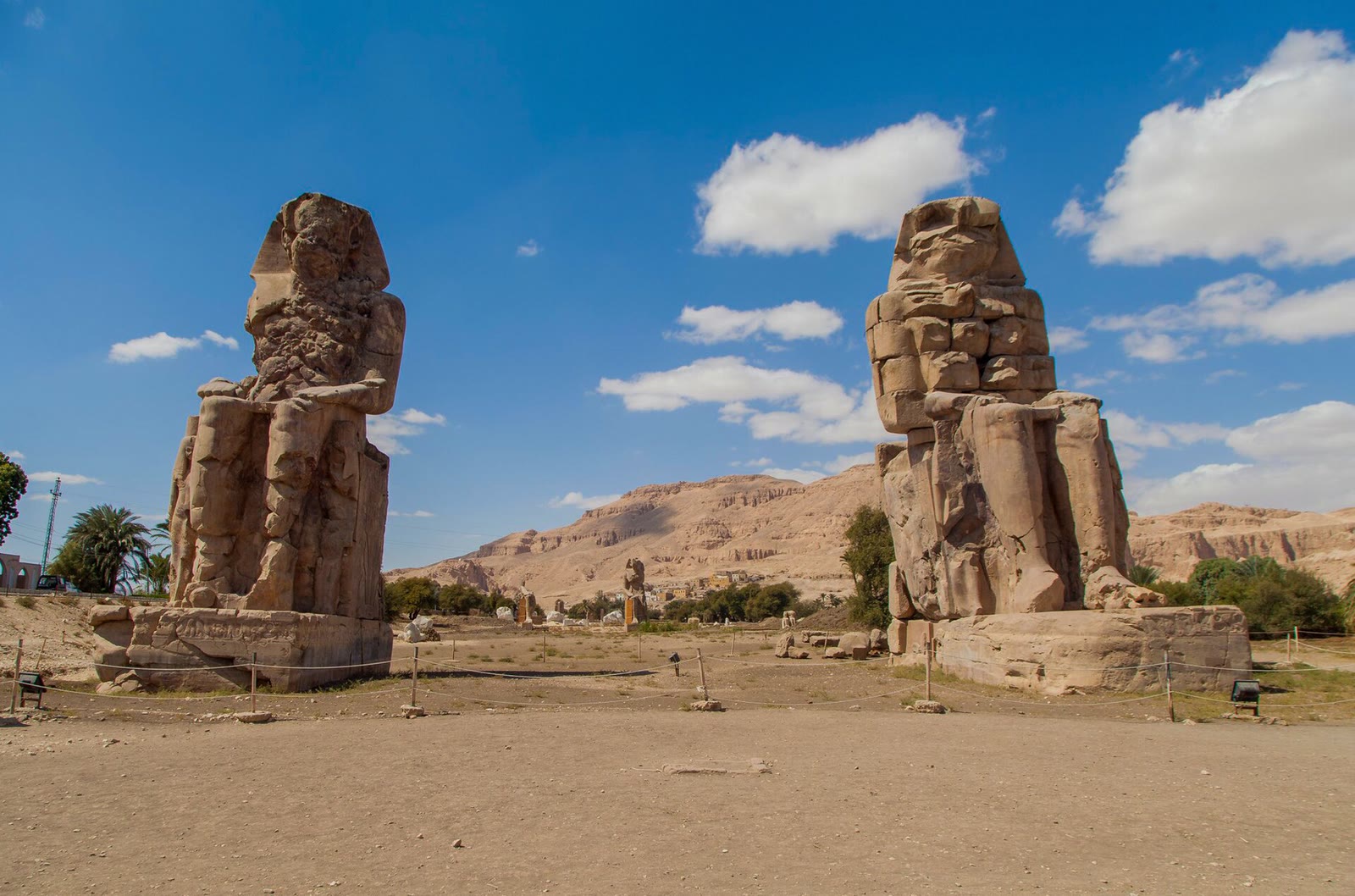 Colossi of Memnon on Luxor's west bank under a clear sky, in the eclipse path